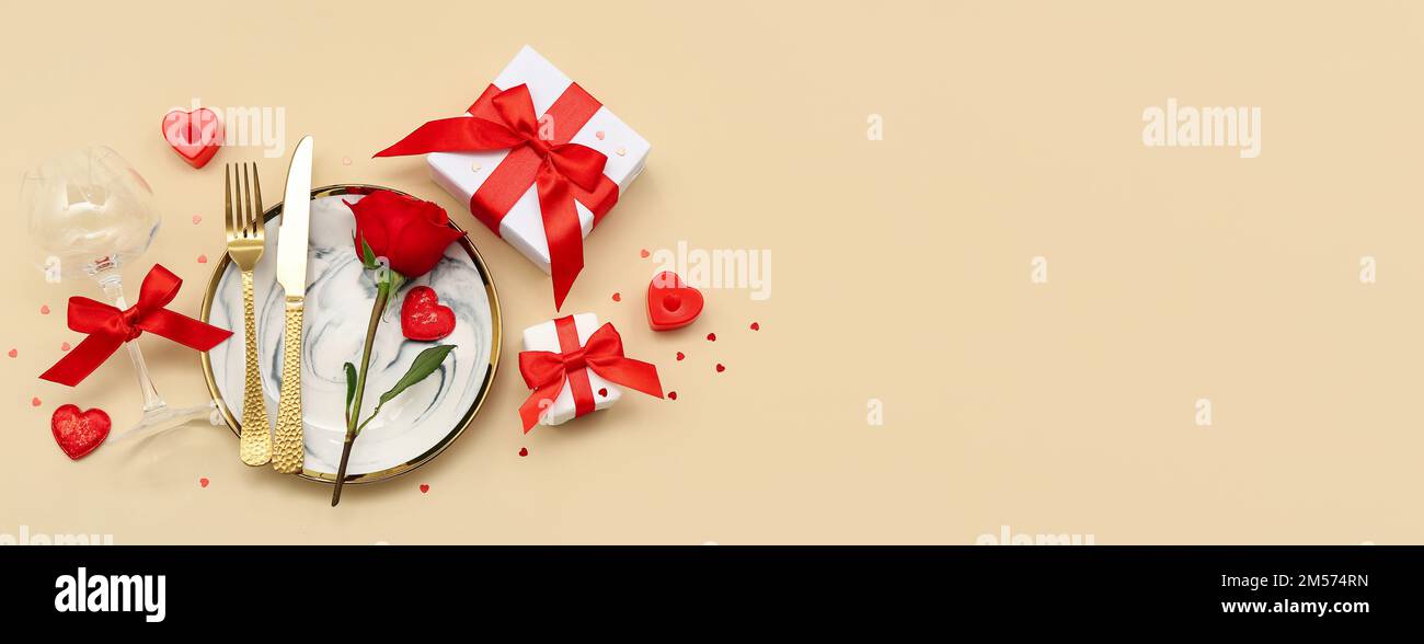 Beautiful table setting for Valentine's Day on beige background with ...
