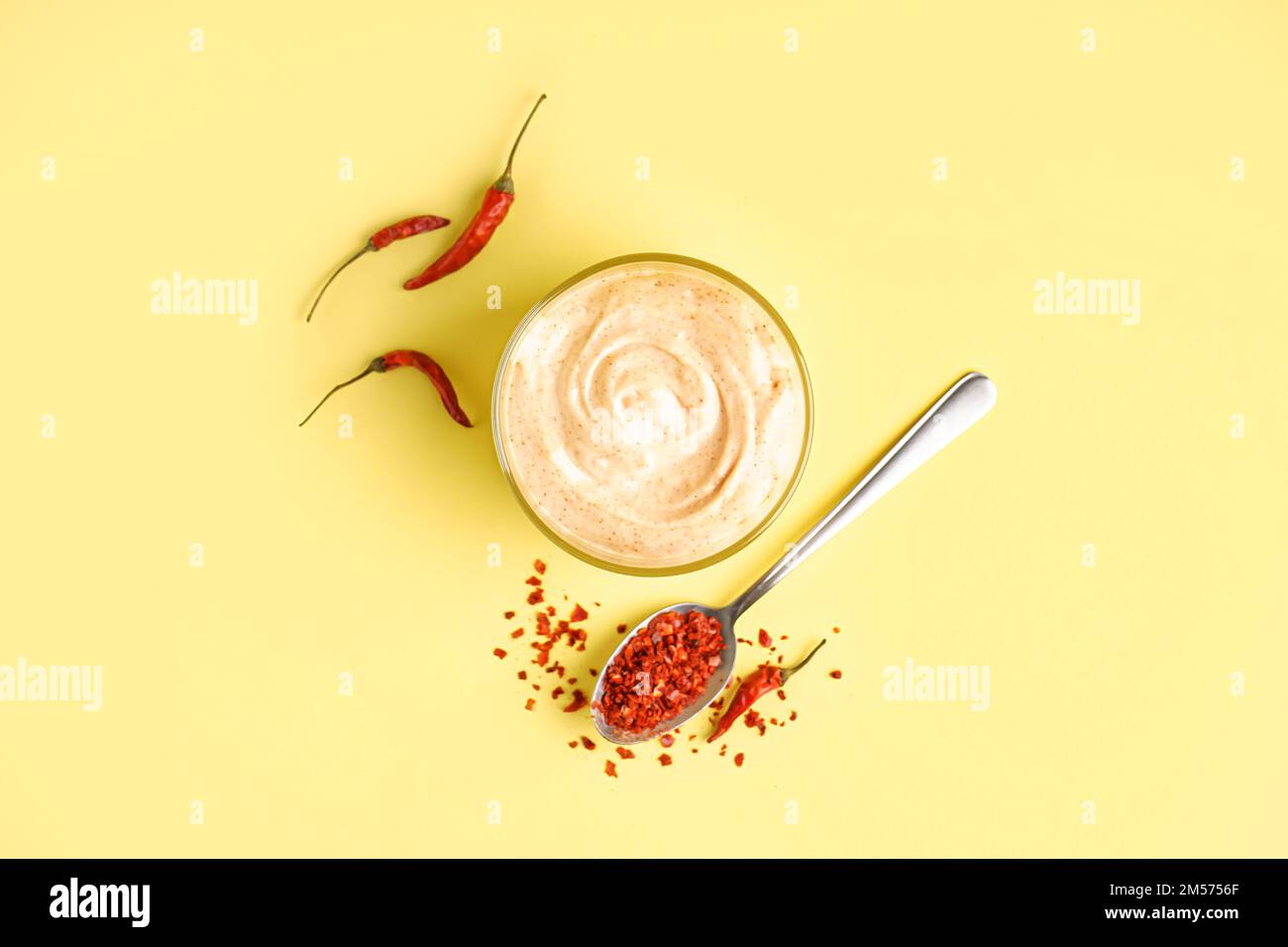 Bowl of tasty chipotle sauce on yellow background Stock Photo