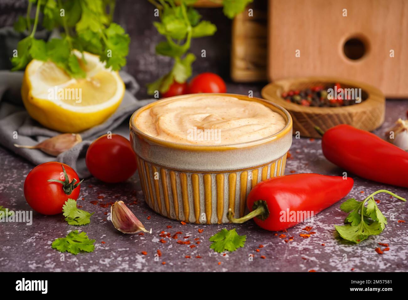 Bowl of tasty chipotle sauce on grunge background Stock Photo