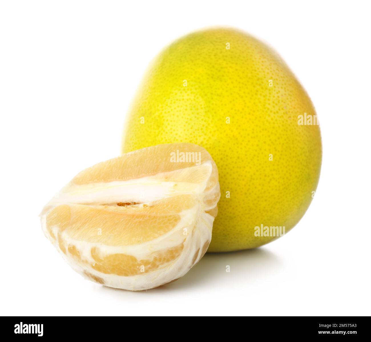 Whole and peeled sweet ripe pomelo fruits on white background Stock