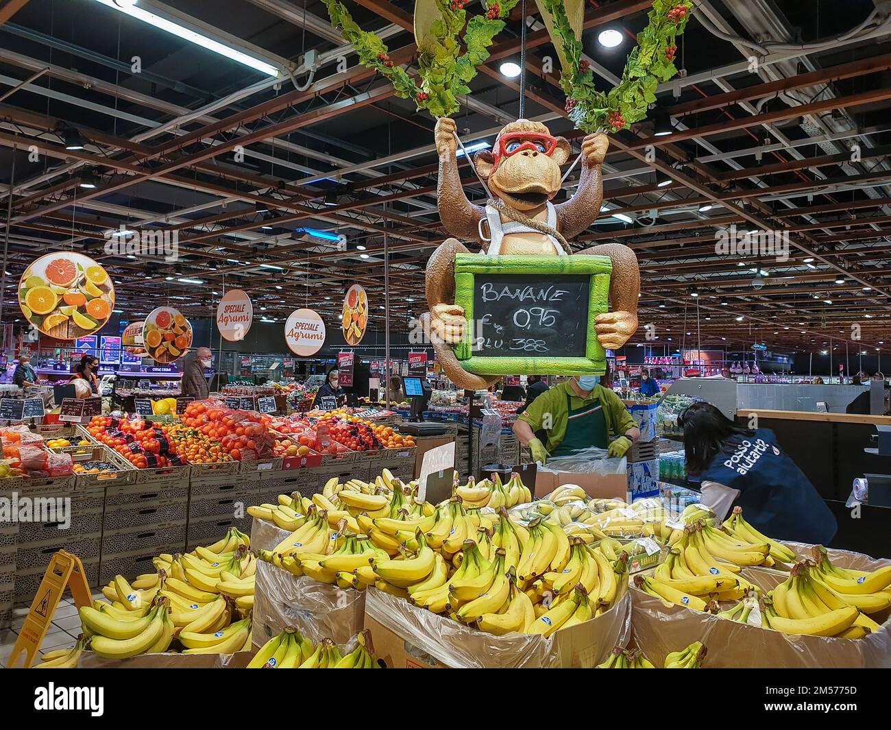 Bergamo, Italy - April 29, 2022: Food selection in Italian Iper supermarket. Fun display of bananas. Stock Photo