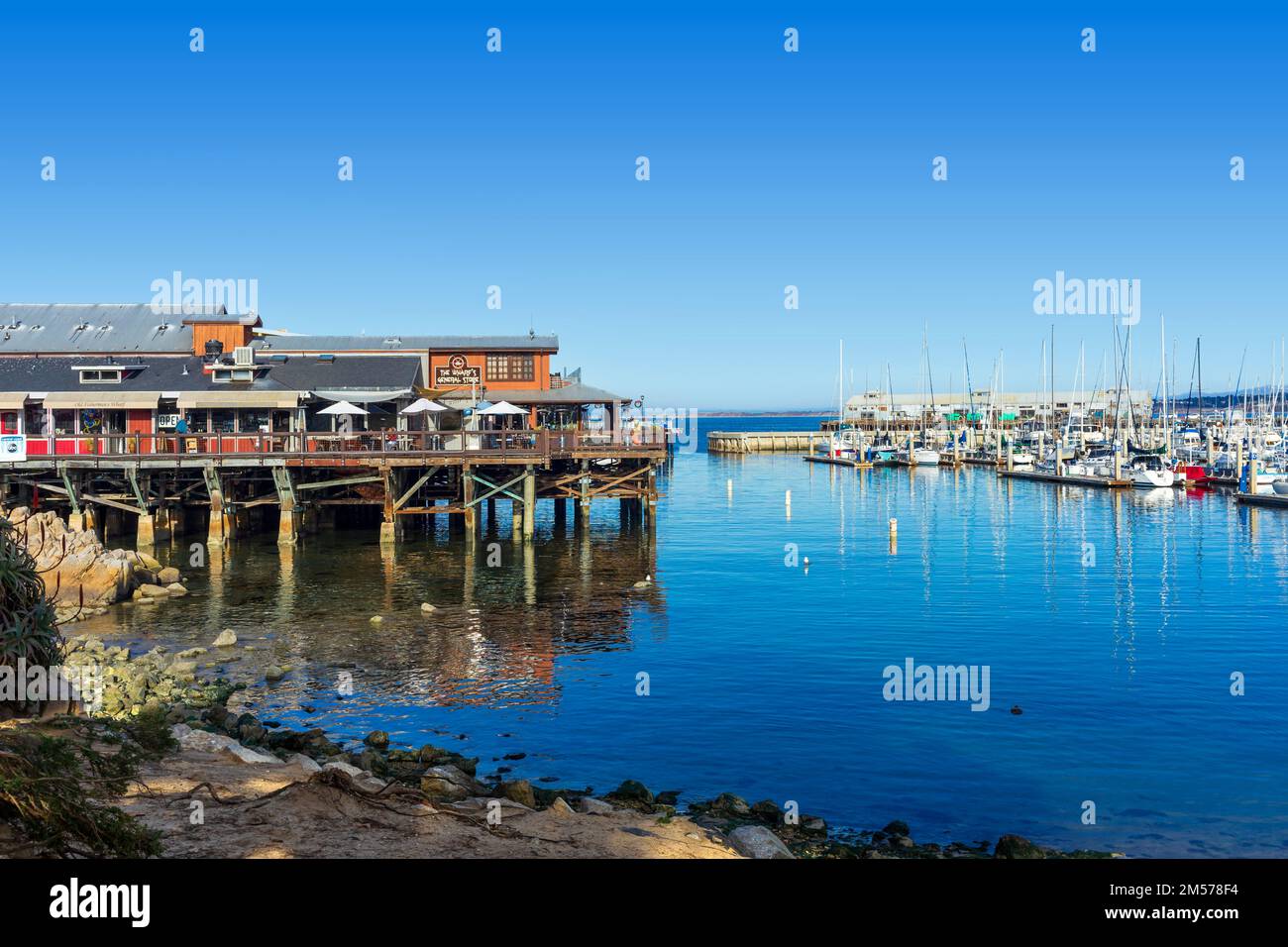 Monterey, CA, USA – December 17, 2022: Scenic view of Fisherman's Wharf and harbor in Monterey, California. Stock Photo
