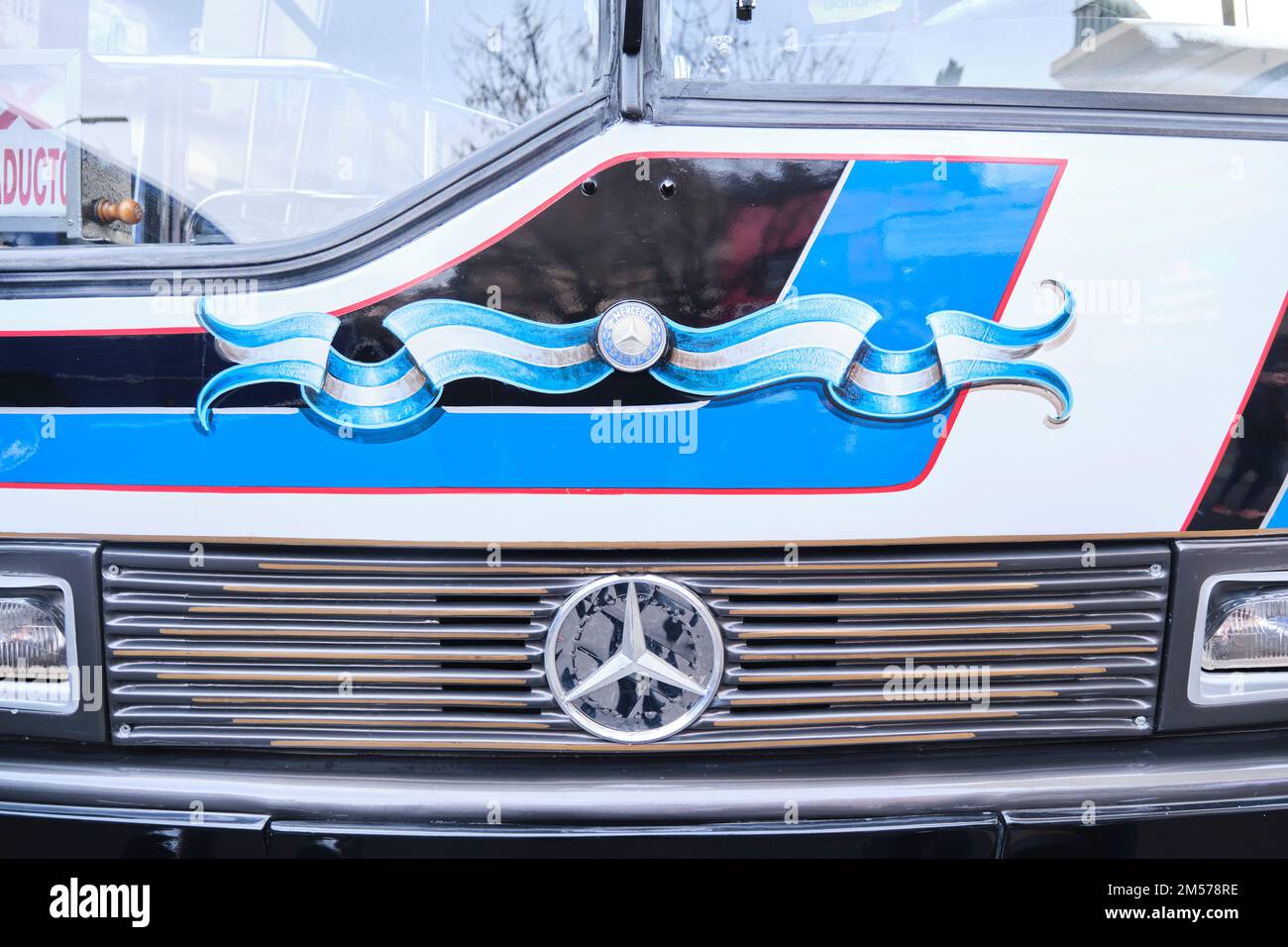 Buenos Aires, Argentina, June 20, 2022: Frontal view of a restored classic Mercedes Benz bus painted with ornaments, flag ribbons, in the fileteado po Stock Photo