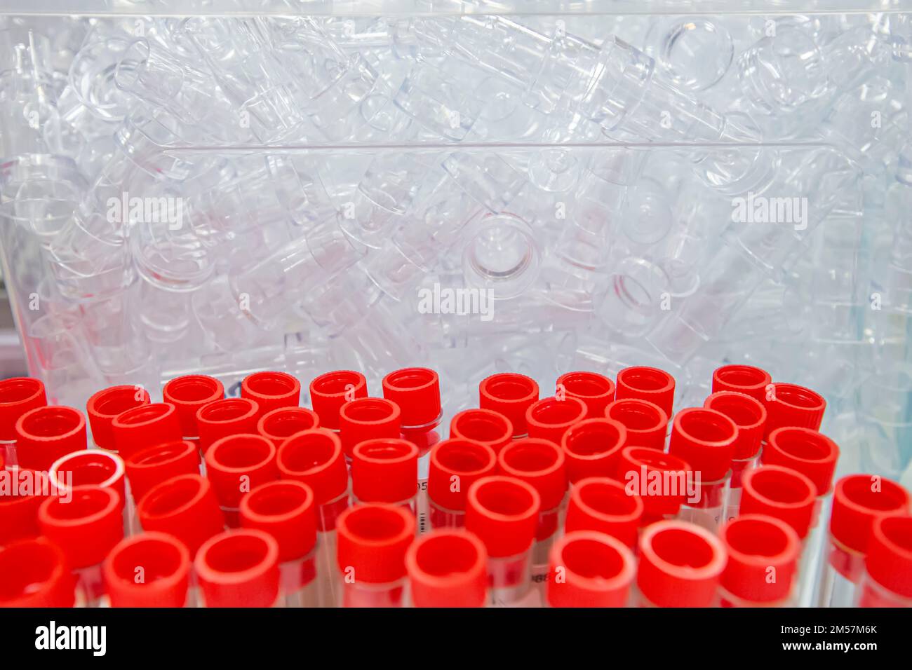 Blood sample tube from a shelf with analysis machines in the laboratory