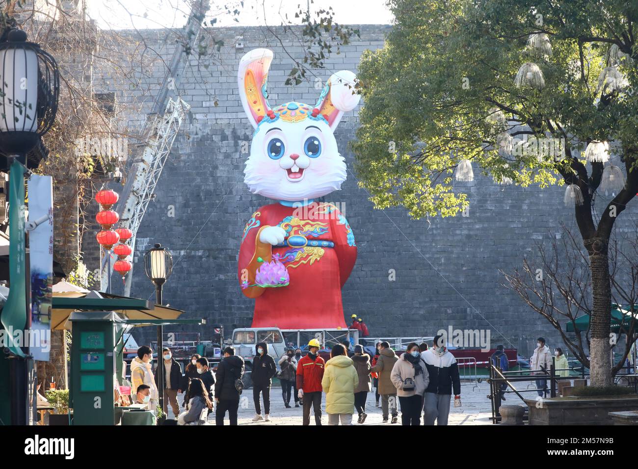 A 15-meter-high giant rabbit in traditional red costume is displayed in ...
