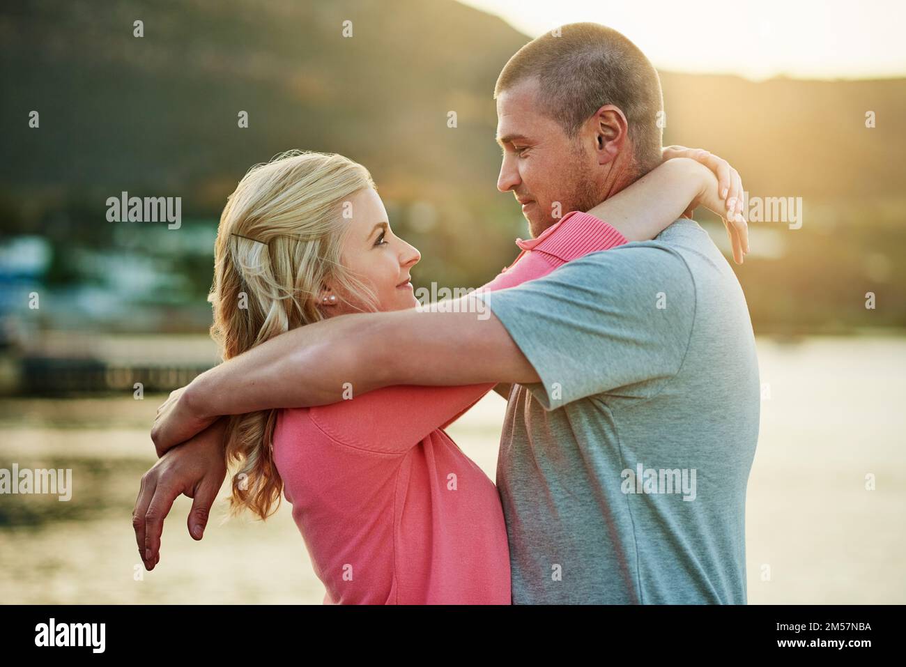 Making time for us. an affectionate couple bonding at the beach. Stock Photo