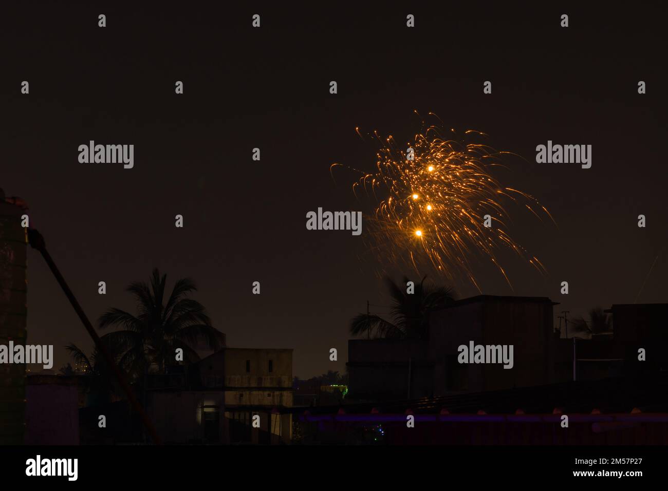 firework during celebration of new year, diwali and other festivals. shot taken against night sky. Stock Photo