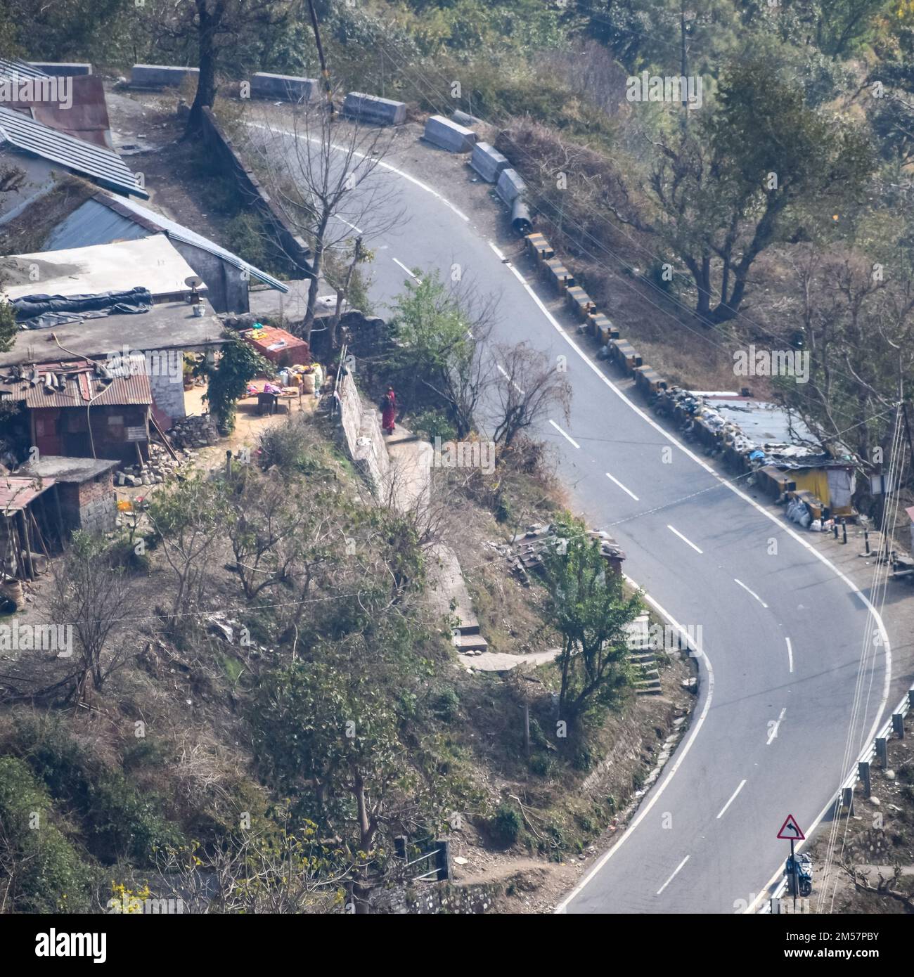 Aerial top view of traffic vehicles driving at mountains roads at Nainital, Uttarakhand, India, View from the top side of mountain for movement of tra Stock Photo