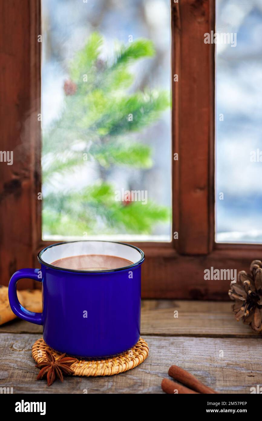 Mug and thermos of hot chocolate on a cold winter day Stock Photo - Alamy