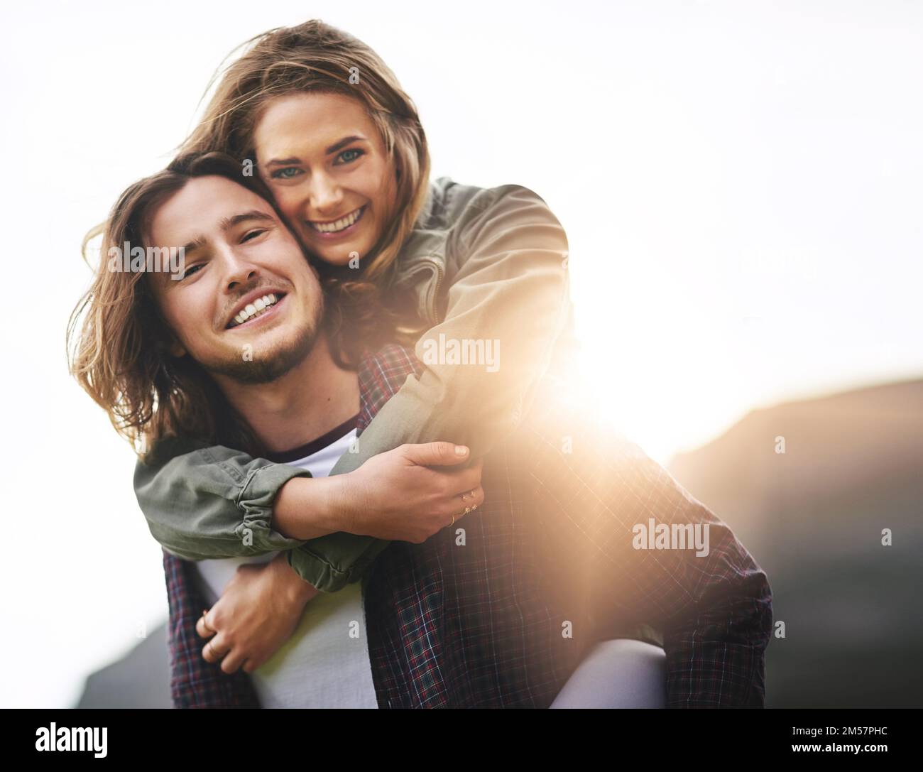 We belong together. Portrait of a happy young couple having fun outside. Stock Photo