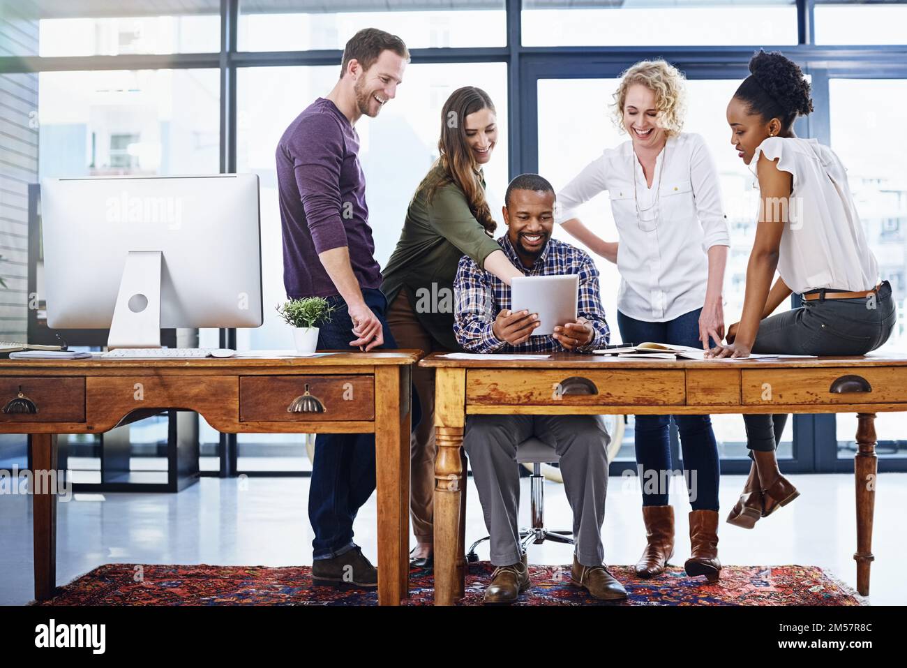 Doing great work together. a team of designers working together in the office. Stock Photo