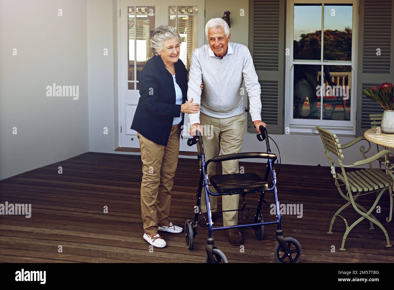 Shes never far fromhis side. Portrait of a smiling senior man using a