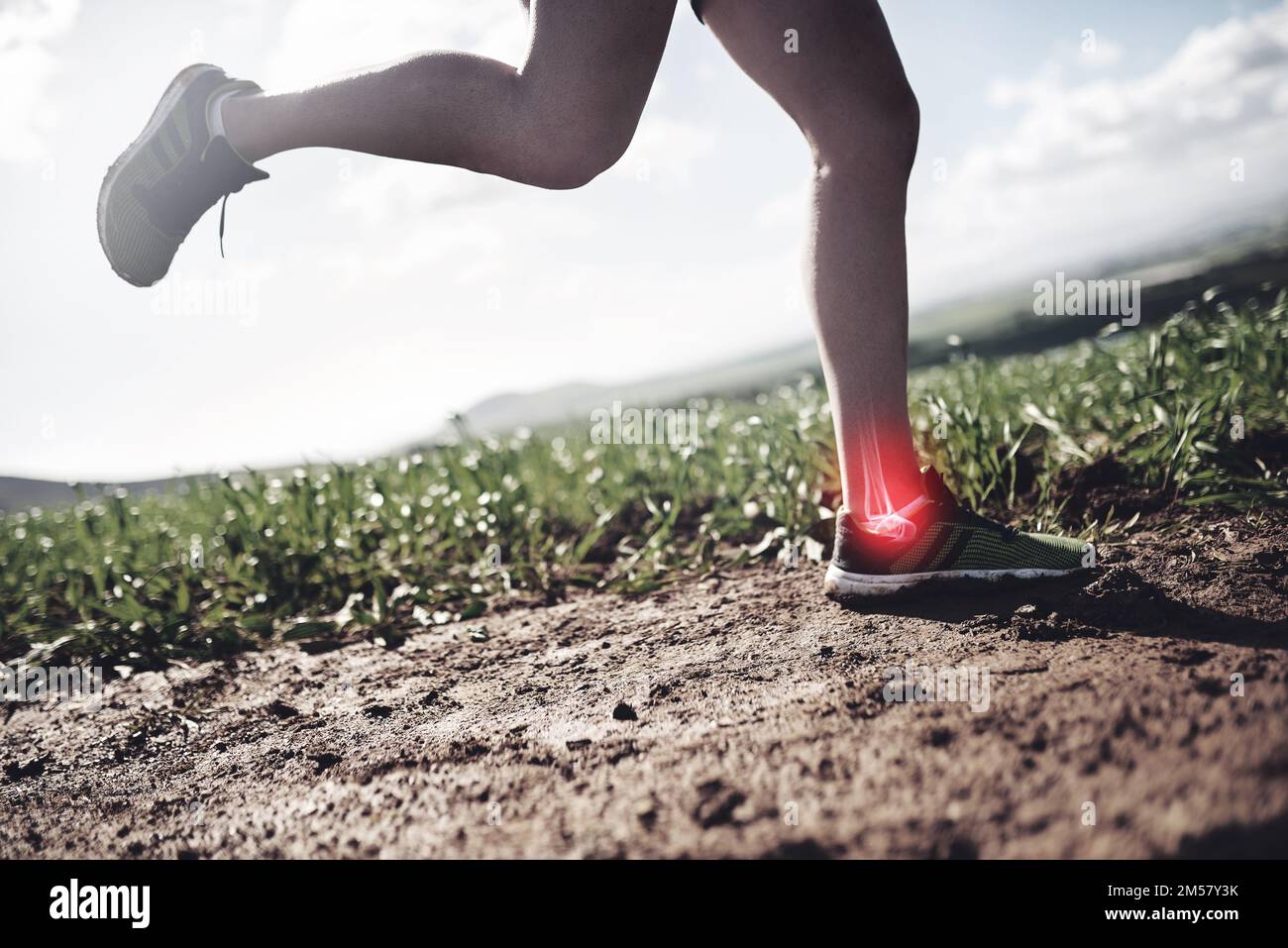 The ankle joint is taking some strain. an unrecognizable man running