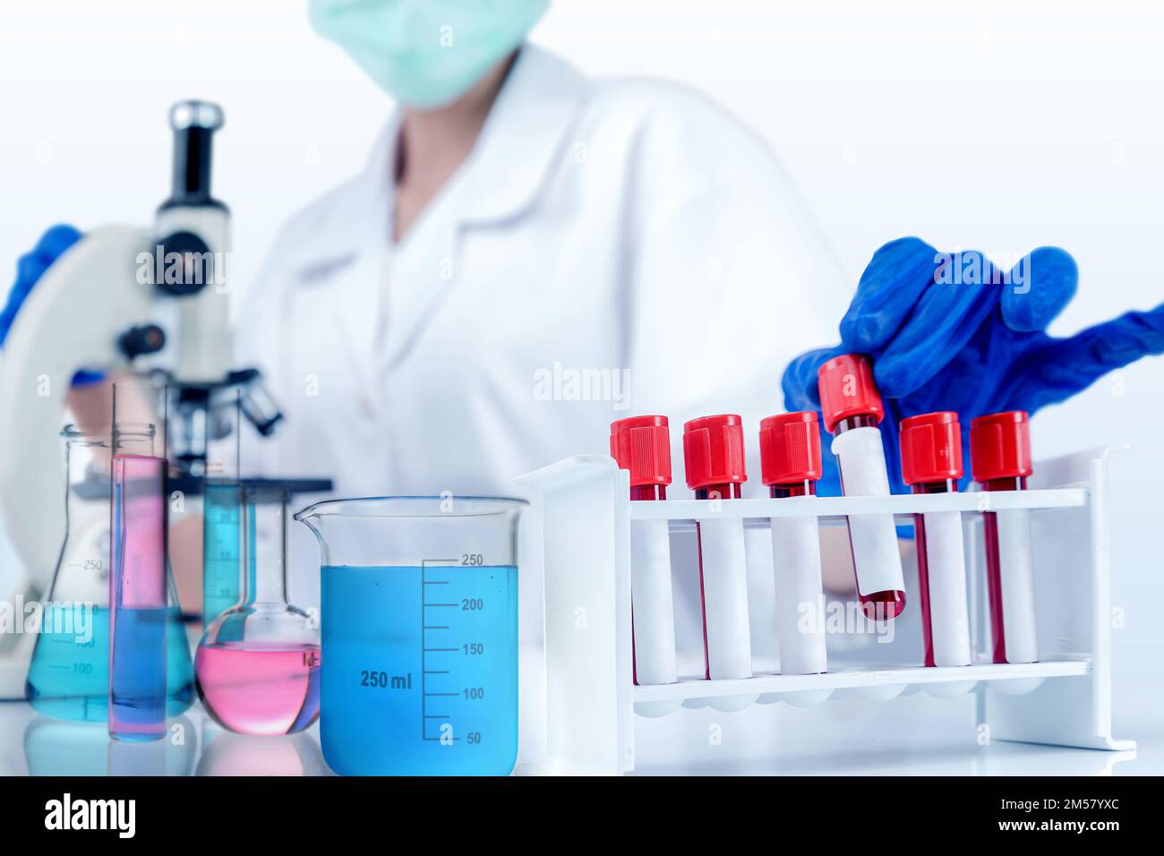 Female scientists take test tubes with microscopes and colorful ...