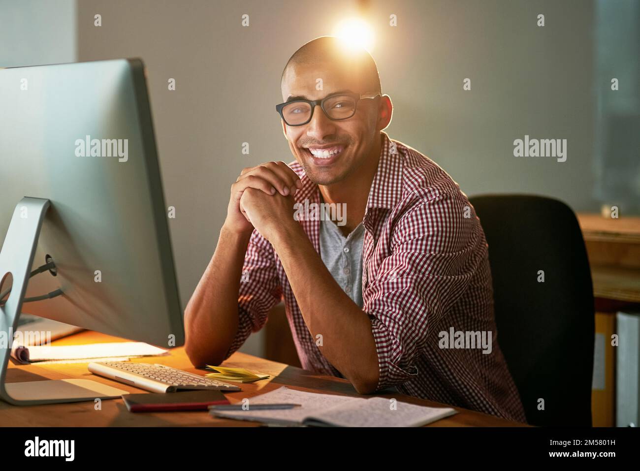 Nothing is impossible if you work hard for it. Portrait of a young designer working late in an office. Stock Photo