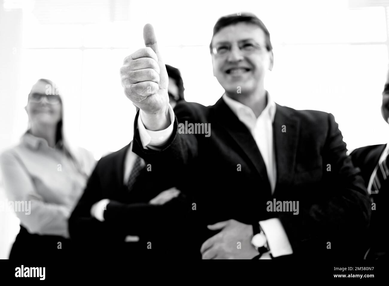 close up. smiling businessman giving a thumbs up. black and white photo. Stock Photo