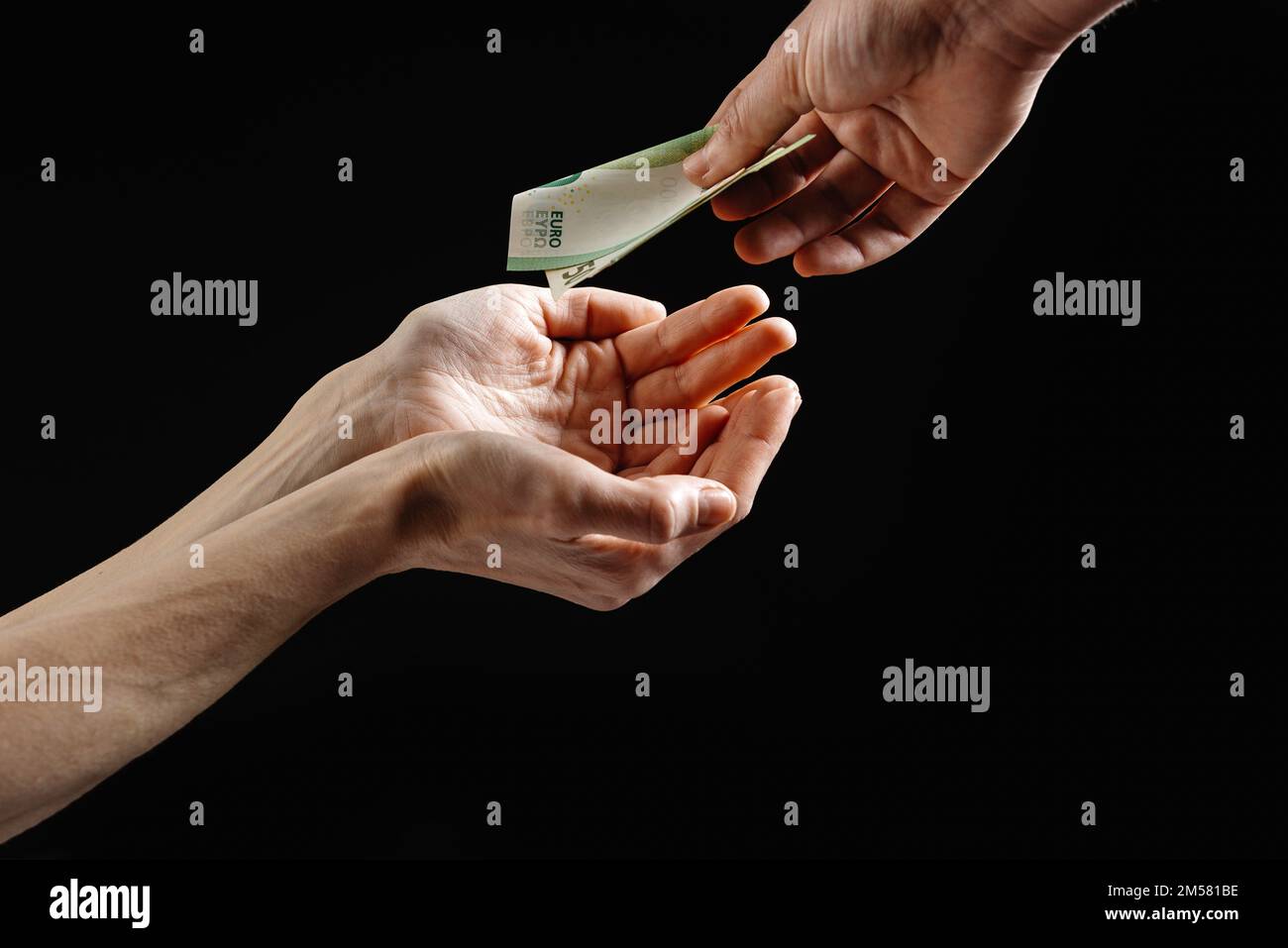 Aid money. Help with money in Europe. The concept of helping homeless and disadvantaged people. Stock Photo