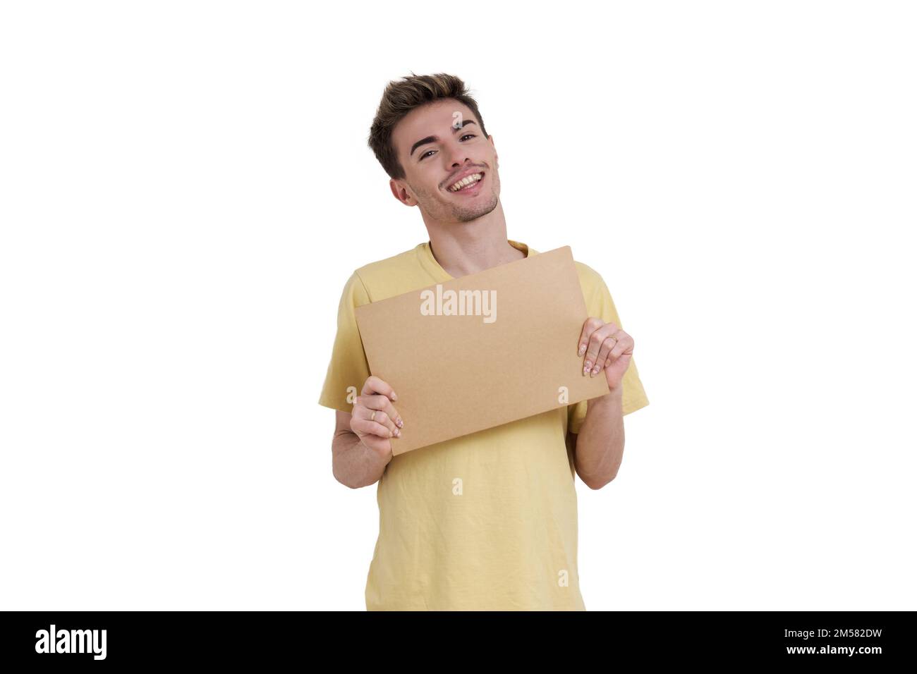 Young caucasian man smiling holding a banner, isolated. Stock Photo