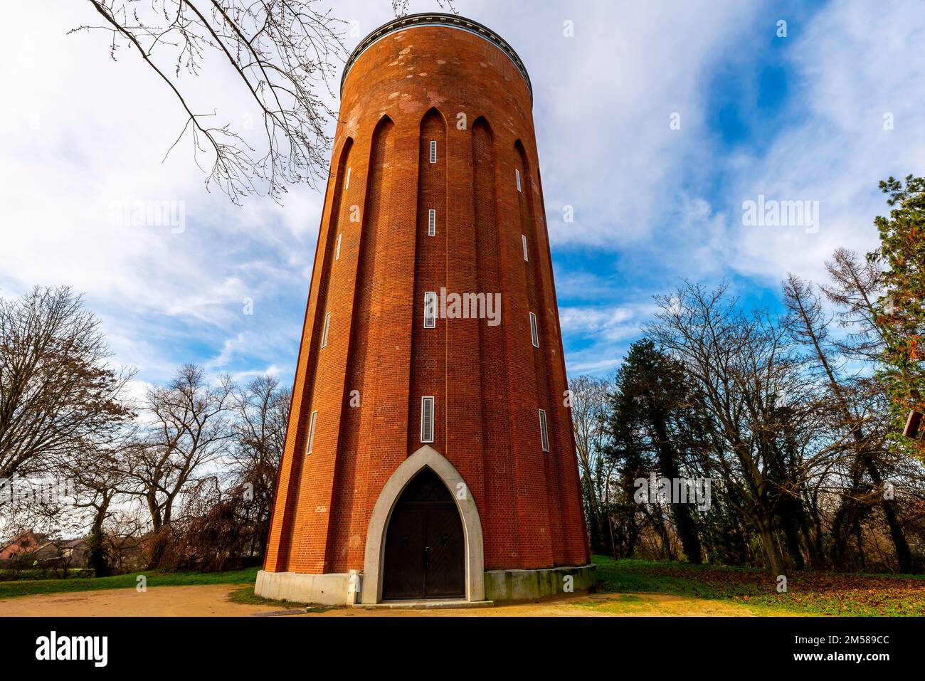 Brick-built constructed circular water tower. Rue du 6 Février 1945. Ensisheim, Alsace, France. Stock Photo
