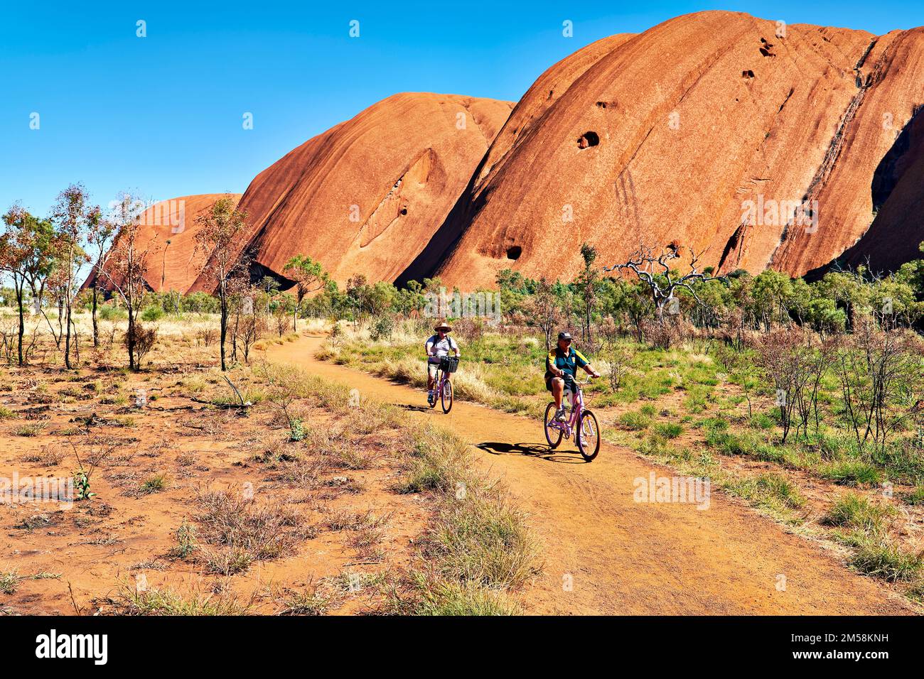Riding a bicycle around Uluru Ayers Rock. Northern Territory. Australia Stock Photo