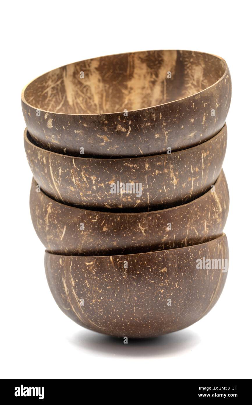 Empty coconut bowl on a white background. Bowls made from coconut shell. Stock Photo