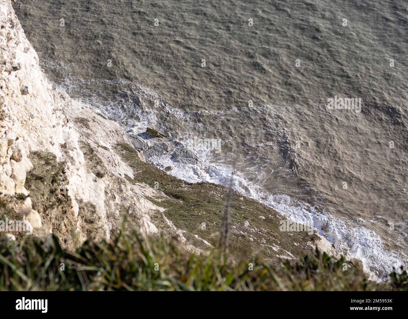 Birds eye view of waves breaking on rocks Stock Photo