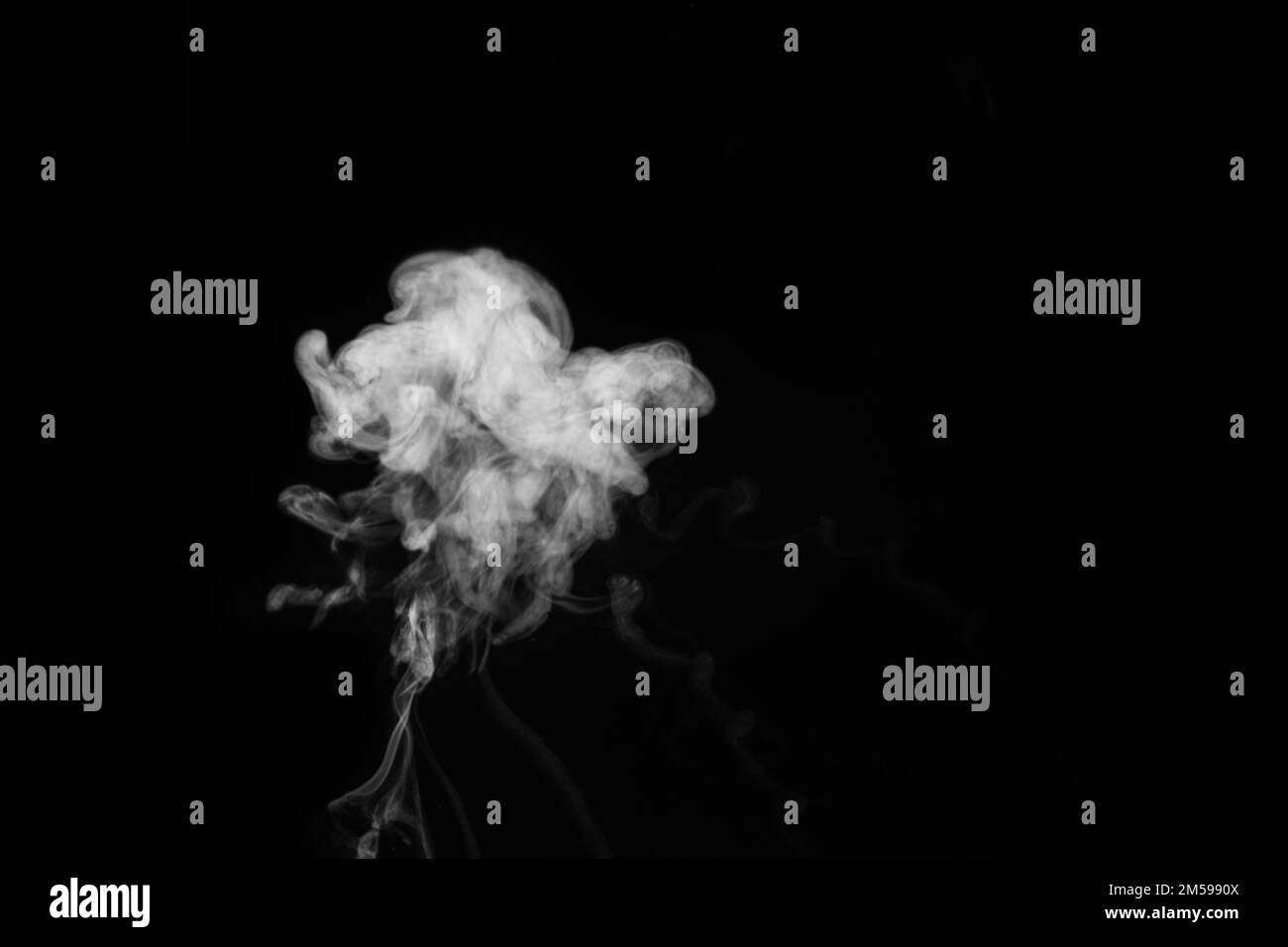 White smoke vapor in the form of a flying cloud is isolated on a black background to overlay your photos. Smoky background. Design element Stock Photo