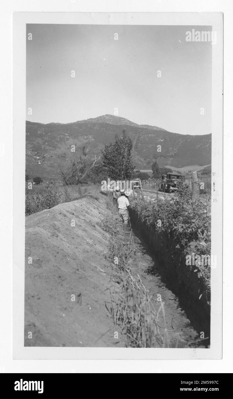 Original caption: 'Trench excavation for A-3d 12' C.P. Pressure line - Rincon Reservation. 6/34 WLM'. 1936 - 1942. Pacific Region (Riverside, CA). Photographic Print. Department of the Interior. Office of Indian Affairs. Mission Agency. 11/15/1920-6/17/1946. Photographs Stock Photo