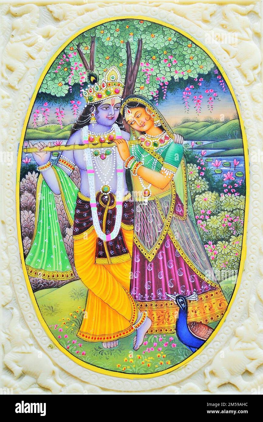 Radha Krishna with flute in garden with peacock artwork painting Stock Photo