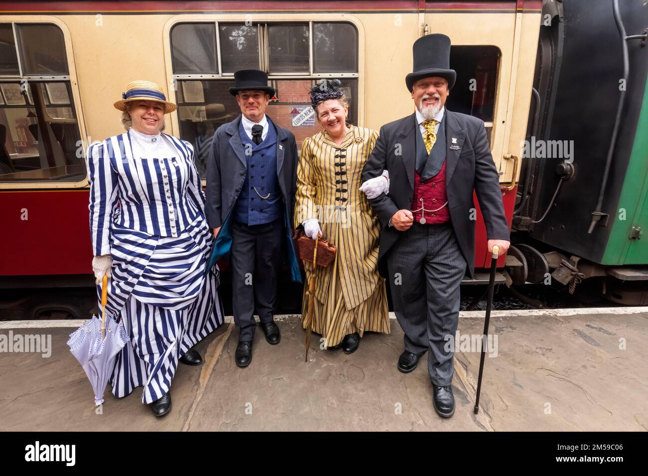 England, Sussex, Bluebell Railway, Sheffield Park Station, Group of Passengers dressed in Victorian Costume *** Local Caption ***  UK,United Kingdom,G Stock Photo