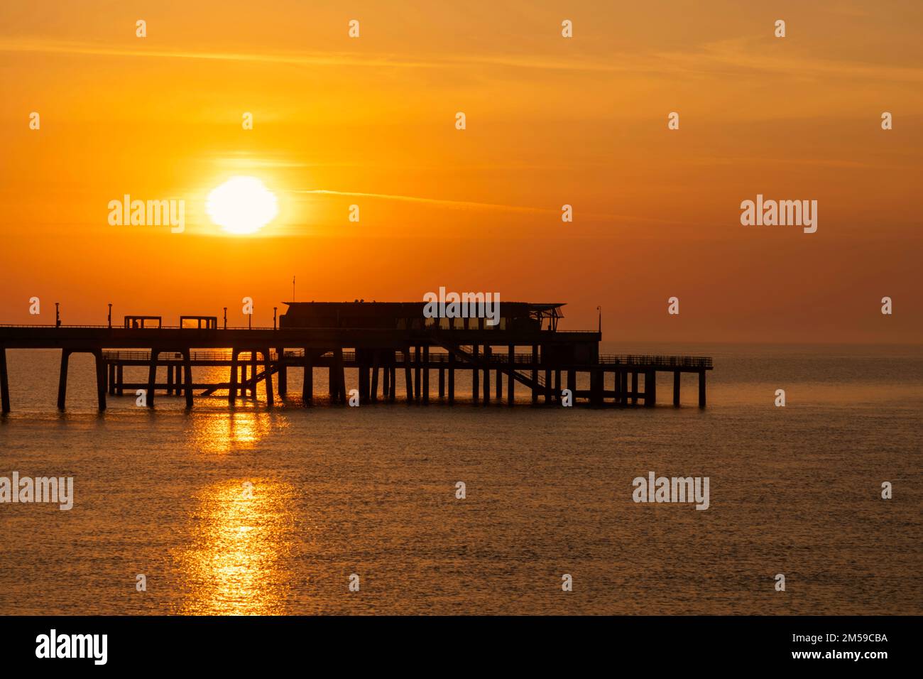 England, Kent, Deal, Sunrise over Deal Pier *** Local Caption ***  Beach,Beaches,Britain,British,Calm,Channel,Coast,Coastal,Dawn,Deal,Deal Pier,Englan Stock Photo
