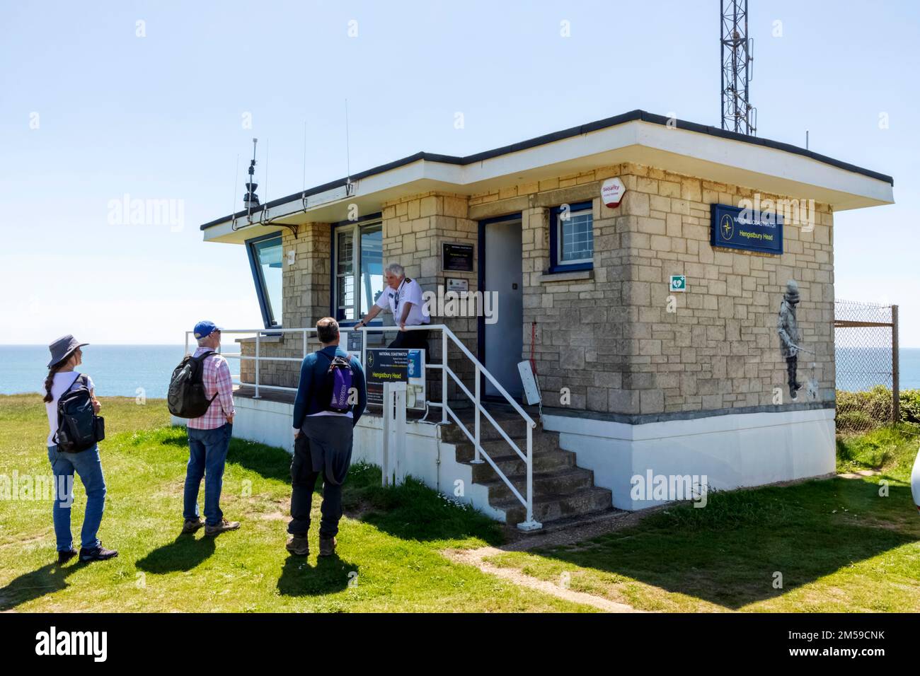 England, Dorset, Christchurch, Hengistbury Head, National Coastwatch Station, Watchkeeper Talking to Visitors *** Local Caption ***  UK,United Kingdom Stock Photo