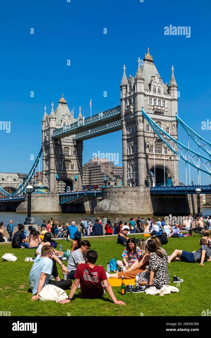 Tower Bridge with People Relaxing on Grass in Foreground, London, England *** Local Caption ***  UK,United Kingdom,Great Britain,Britain,British,Engli Stock Photo