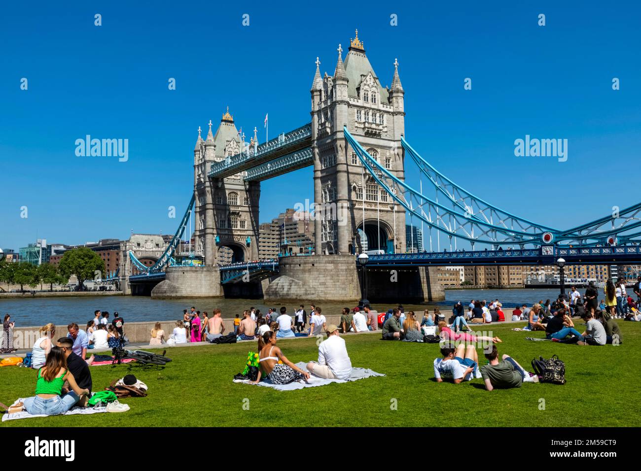 Tower Bridge with People Relaxing on Grass in Foreground, London, England *** Local Caption ***  UK,United Kingdom,Great Britain,Britain,British,Engli Stock Photo