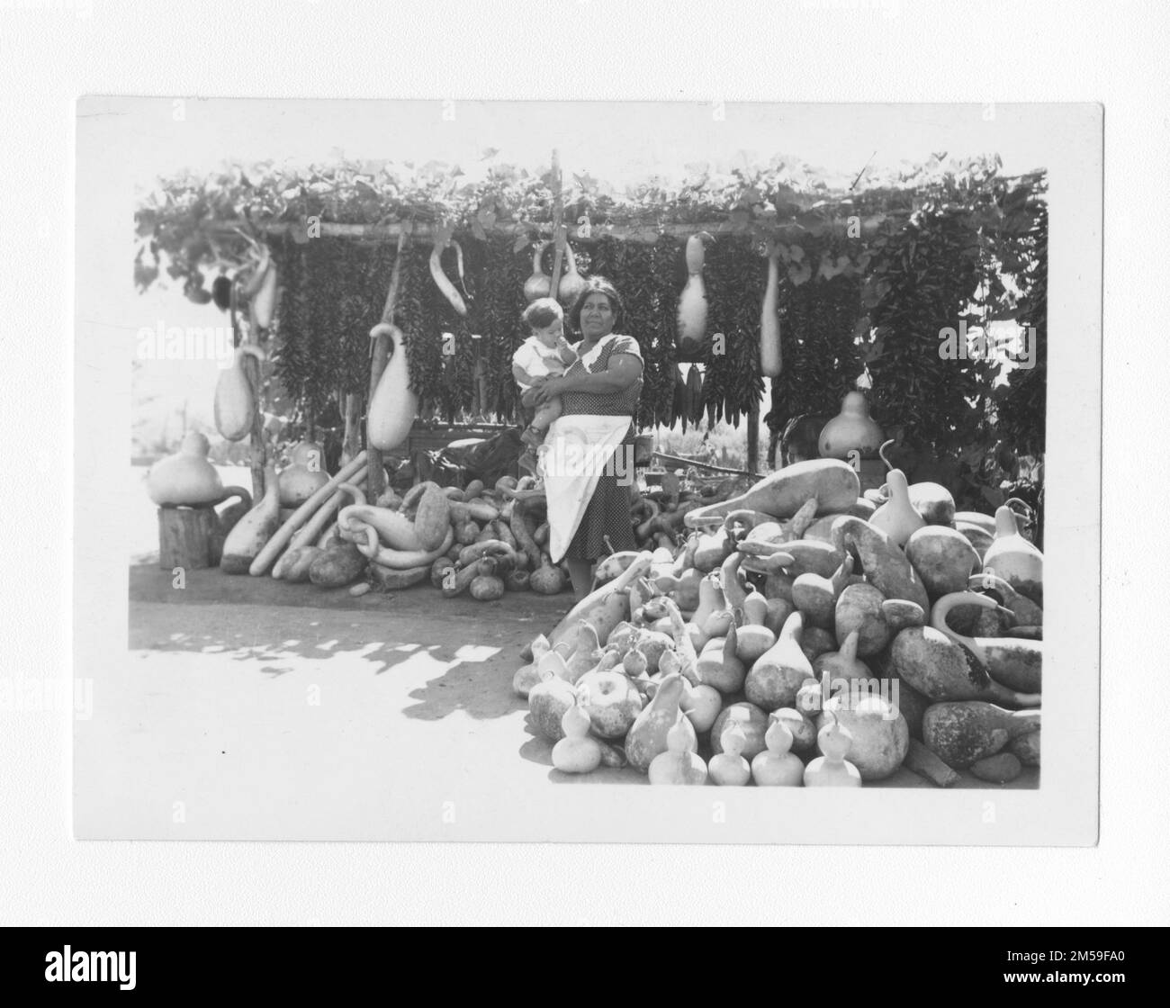 Indian woman holding baby Black and White Stock Photos & Images - Alamy