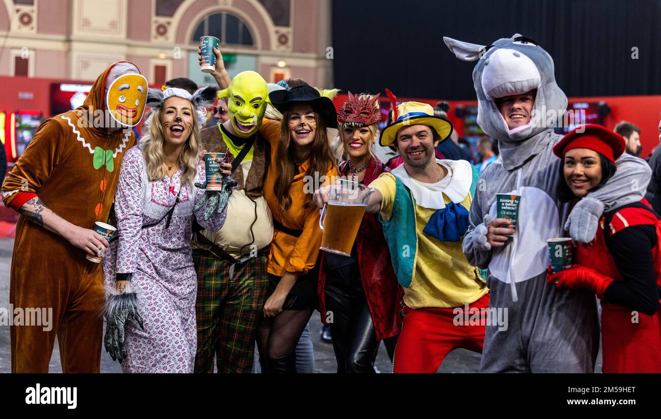 Fans in fancy dress arriving for day ten of the Cazoo World Darts  Championship at Alexandra Palace, London. Picture date: Tuesday December  27, 2022 Stock Photo - Alamy