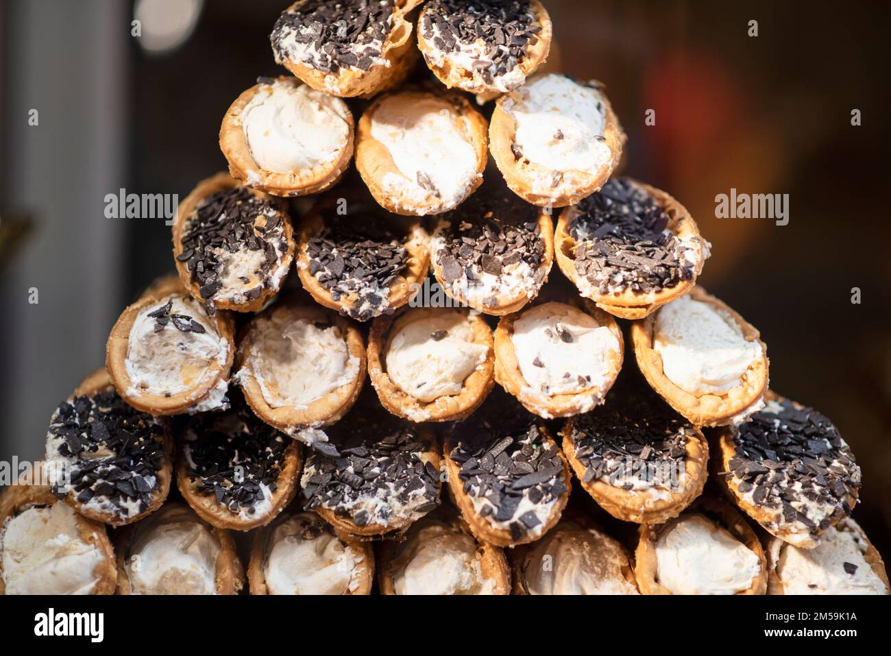 Closeup of sweets with chocolate and cream on display at a pastry shop