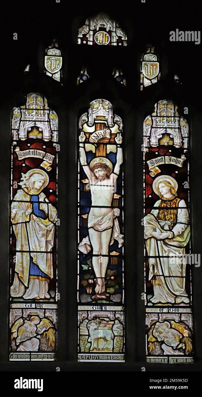 Stained glass window by Heaton Butler & Bayne depicting the Crucifixion of Christ, St Anthony in Meneage, Cornwall Stock Photo