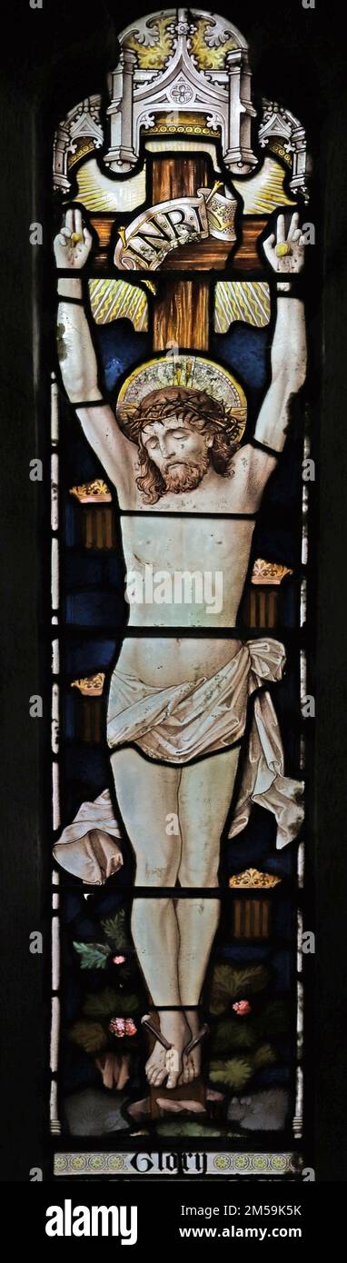 Stained glass window by Heaton Butler & Bayne depicting the Crucifixion of Christ, St Anthony in Meneage, Cornwall Stock Photo