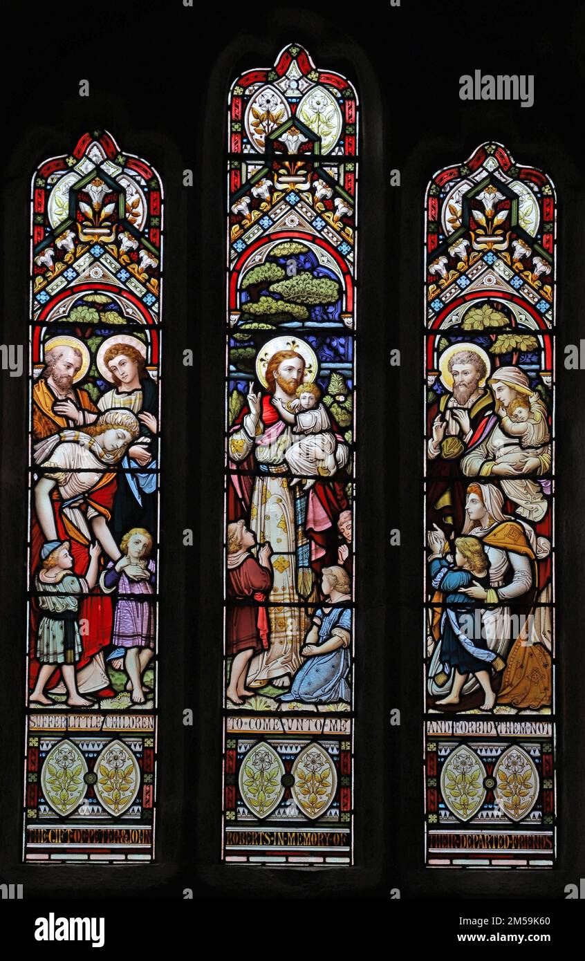 Stained glass window by John Hall and Sons depicting Christ blessing children, St Wynwallow's Church, Landewednack, Cornwall Stock Photo