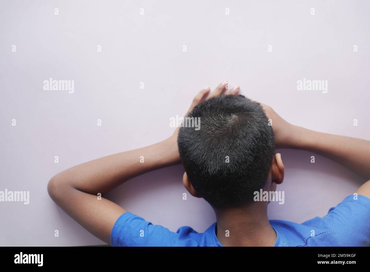teenage boy head down on desk Stock Photo Alamy