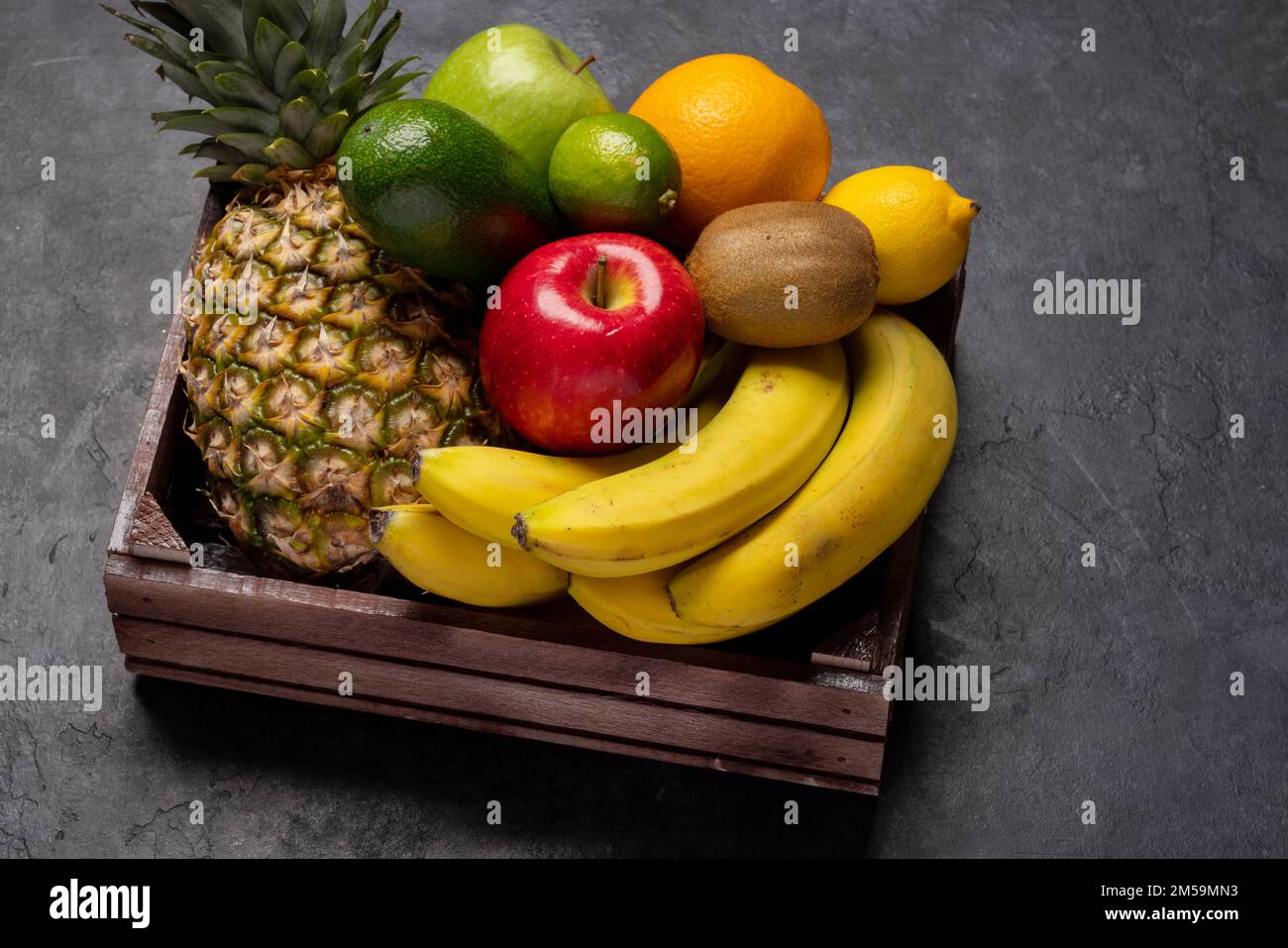 Wooden box full of healthy fruits food Stock Photo - Alamy