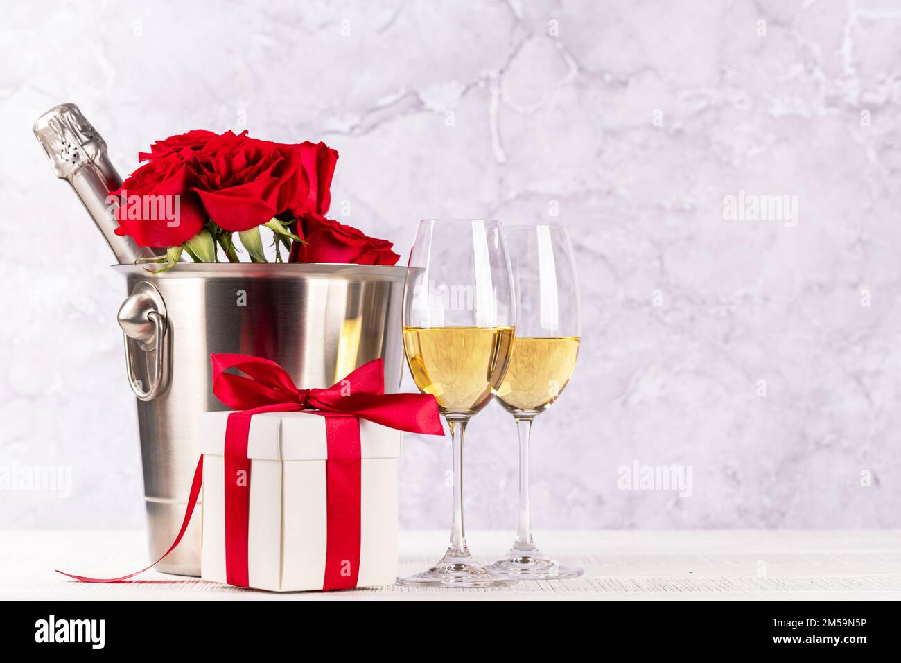 Valentines day card with champagne, rose flowers and gift box. With ...