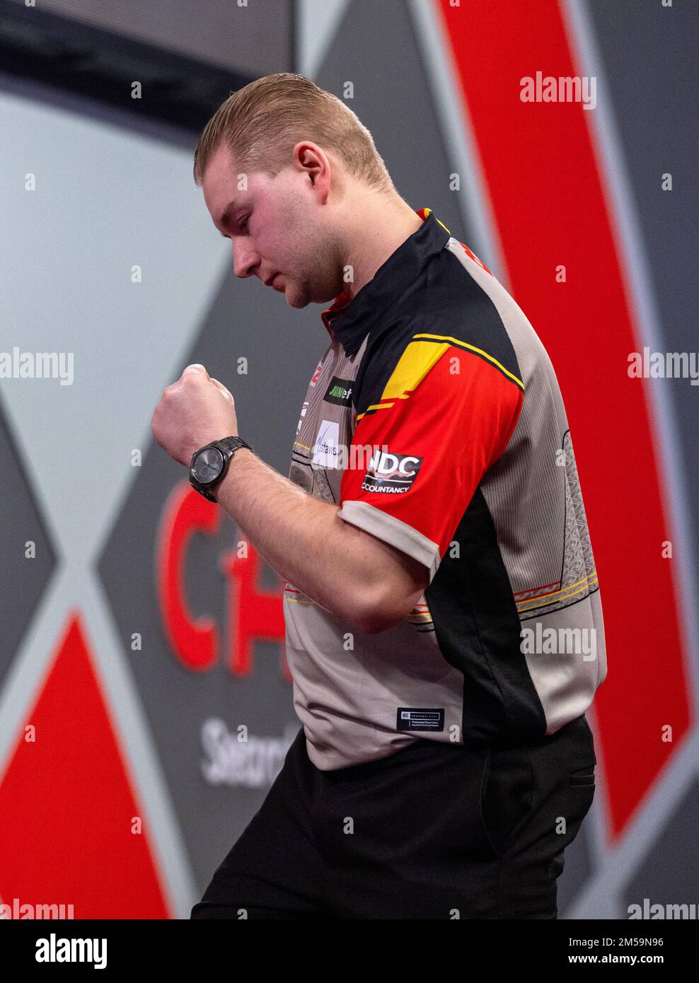 Dimitri Van den Bergh celebrates winning his match during day ten of