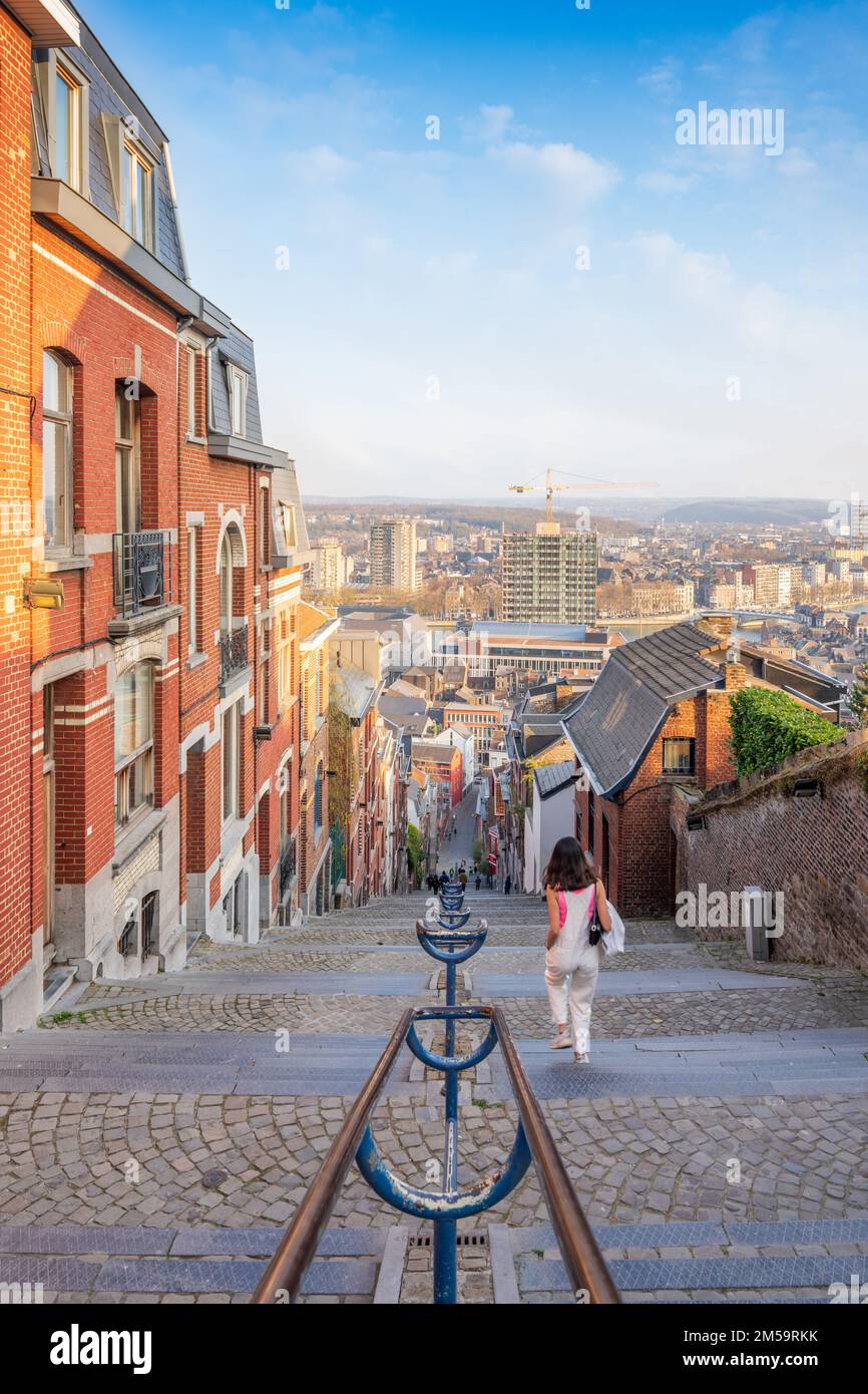 A scenic view of a female walking down the Montagne de Bueren stairway in Liege, Belgium Stock Photo