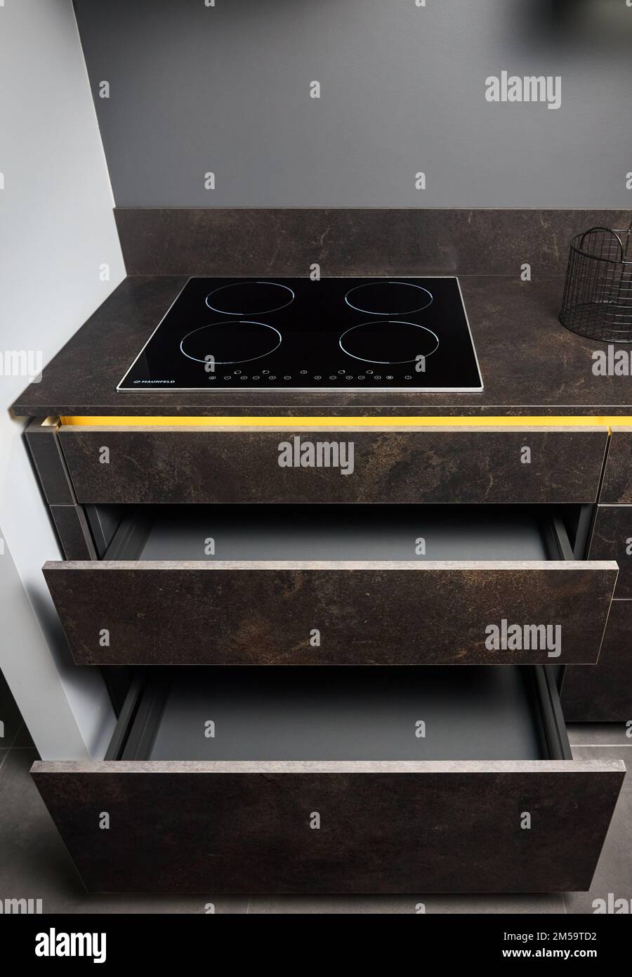 Induction cooker black glass hob or aspirating induction hob on marble