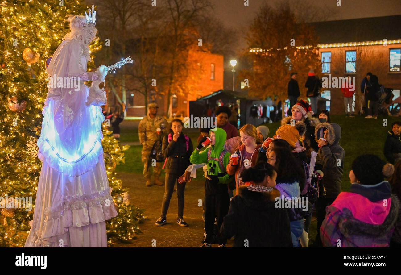 The festive holiday actor speaks to children Dec. 1, 2022, at Royal Air Force Mildenhall, England.The Christmas tree lighting ceremony had multiple actors, vendors and activities for Team Mildenhall families. Stock Photo