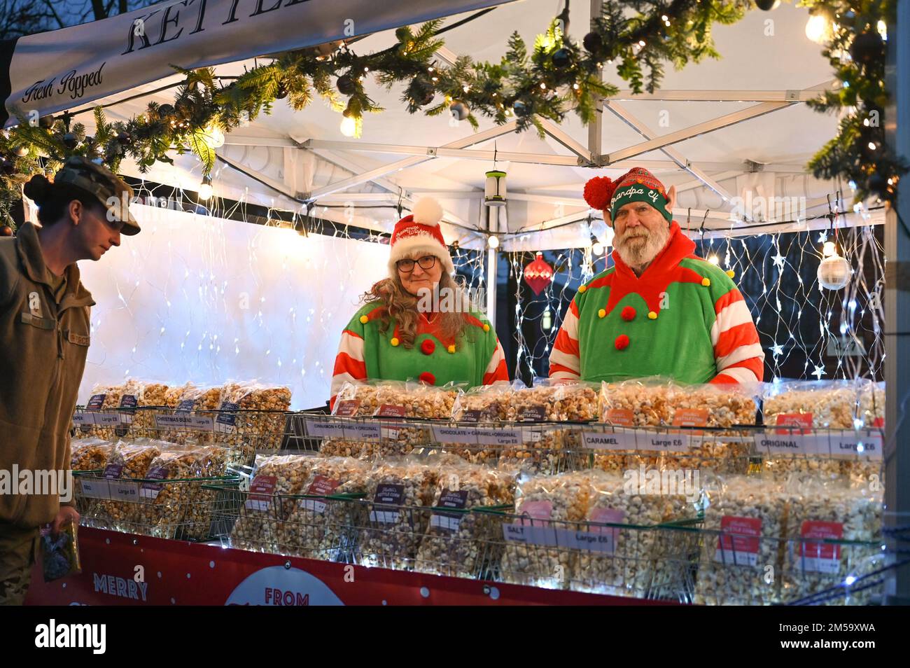 Two vendors smile at their kettle corn stand Dec. 1, 2022, at Royal Air Force Mildenhall, England. The vendors were part of the holiday market in Washington Square for the weekend. Stock Photo