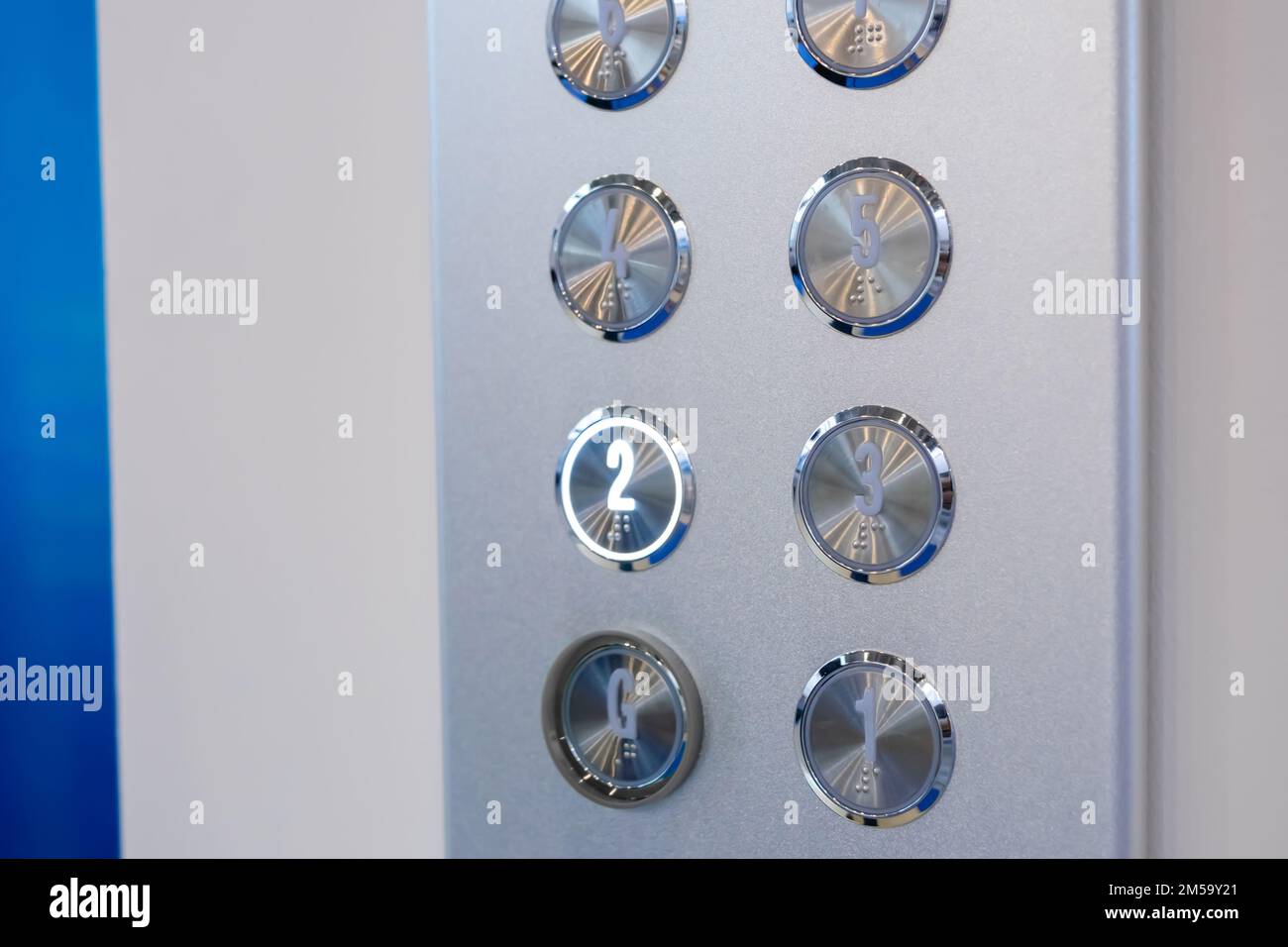 Elevator floor buttons on lift control panel at mall, hotel or business