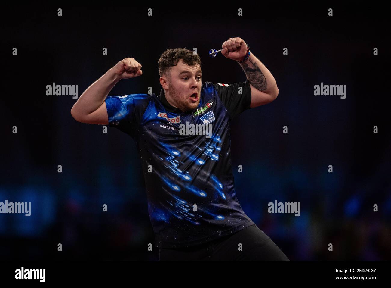 Josh Rock celebrates winning against Nathan Aspinall in their match